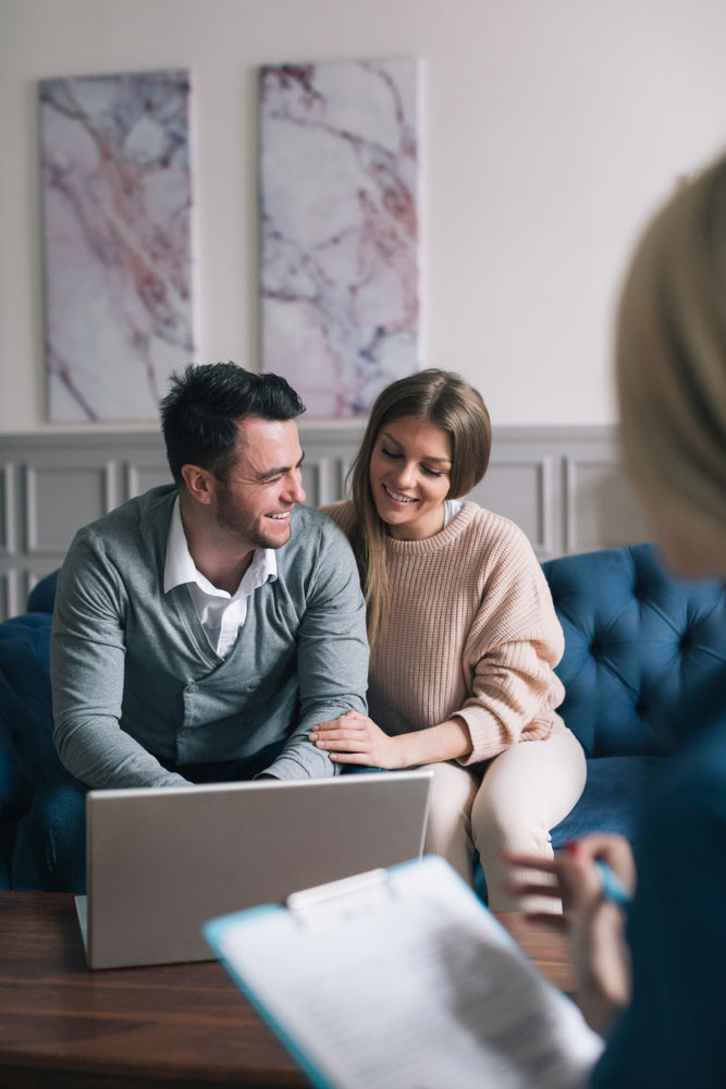 Family meeting real-estate agent for house investment.